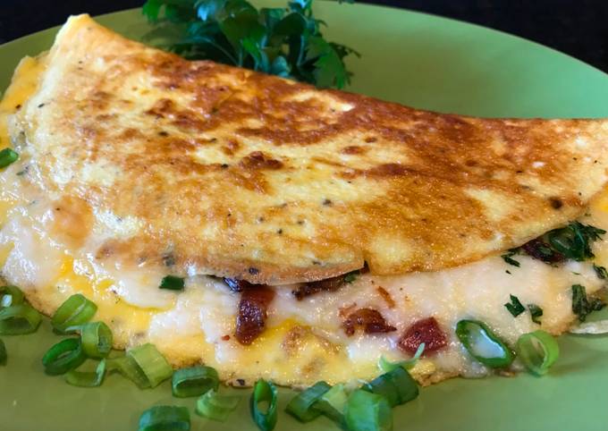 A picture of Omelette with Crispy Bacon, Vegetables and Mozzarella Cheese.