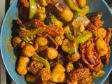 A picture of Chicken sausage vegetable tray bake with red pesto.