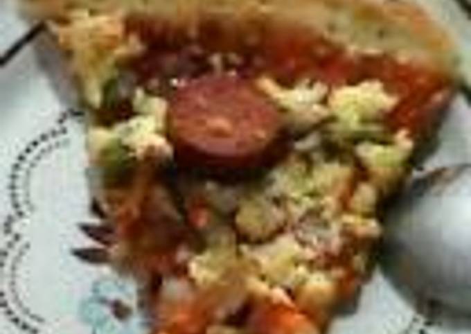 A picture of Pizza (Chicken and vegetables) with ghee.