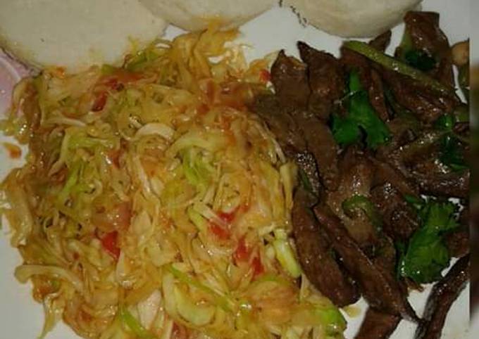 A picture of #tbt1 fried liver & sauteed cabbage.