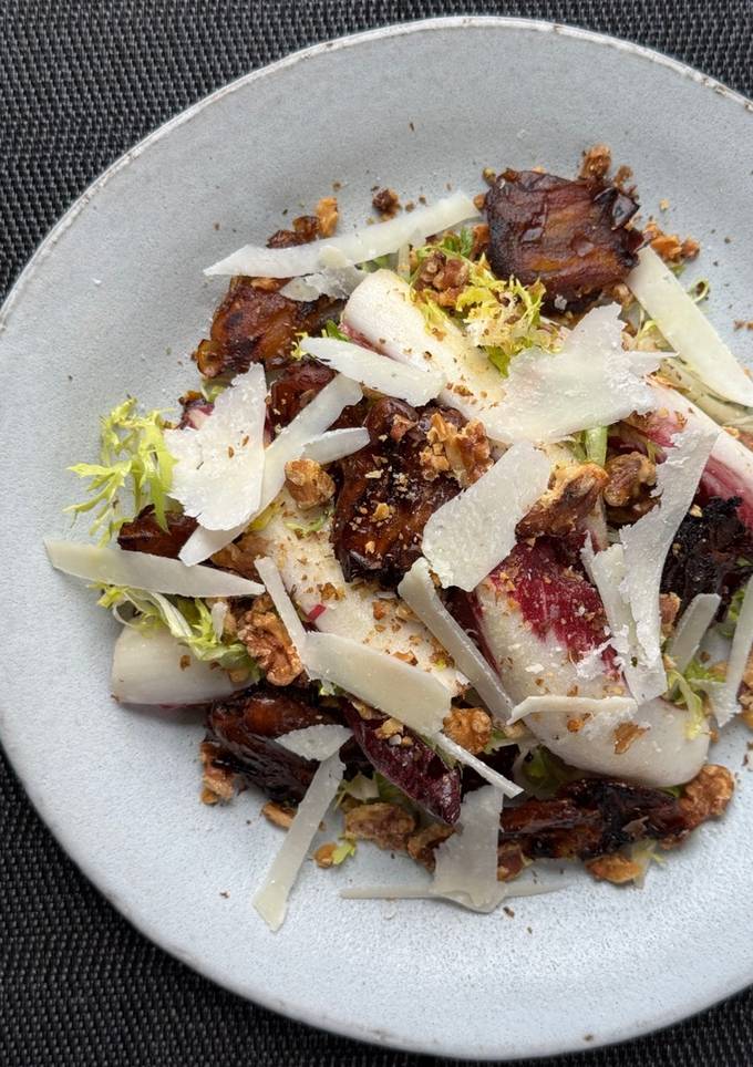 A picture of Bitter leaf salad with charred dates and vinaigrette.