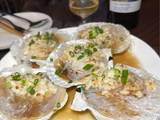 A picture of Steamed scallops with onion and glass noodles.