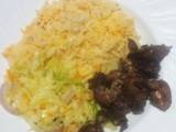 A picture of Steamed cabbage served with rice and chicken liver.