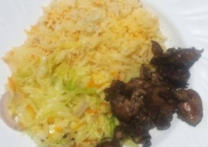 A picture of Steamed cabbage served with rice and chicken liver.