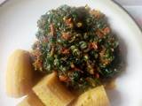 A picture of Boiled unripe plantain with veg sauce.