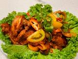 A picture of Ayam Masak Merah Malaysia (Chicken in spicy tomato sauce).