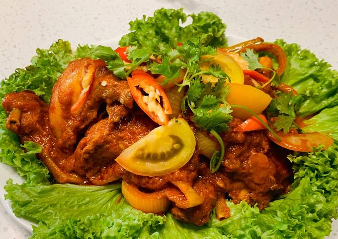 A picture of Ayam Masak Merah Malaysia (Chicken in spicy tomato sauce).