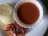 A picture of Oven baked carrot strips with smooth mashed potatoes and homemade garlic tomato sauce.