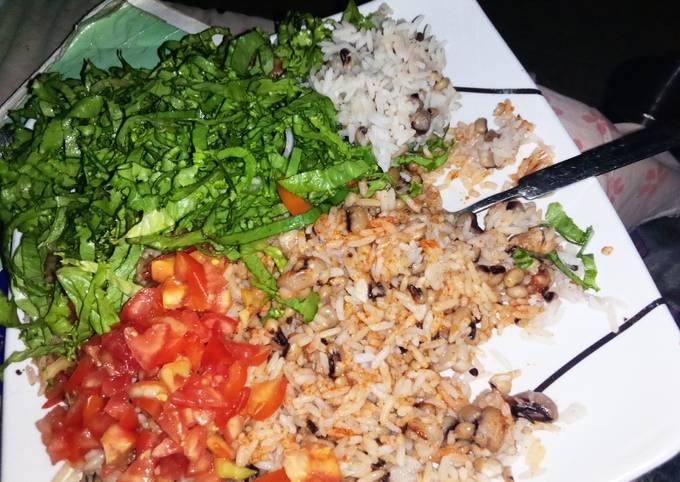 A picture of Rice and beans with vegetables.