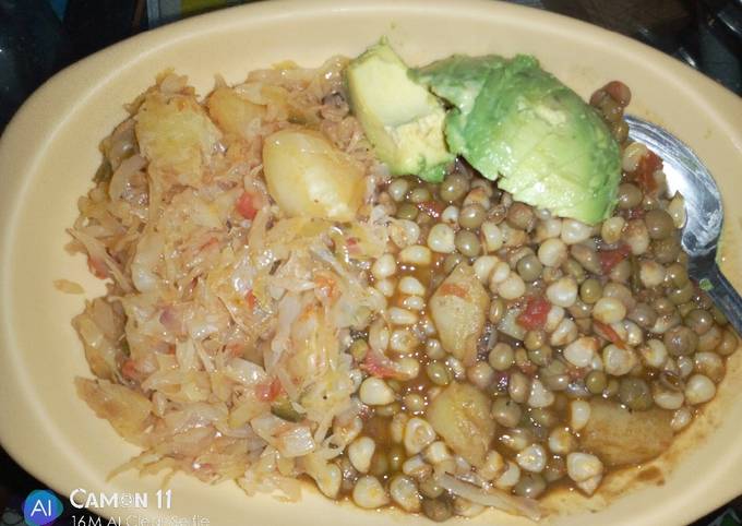 A picture of Githeri and steamed cabbage plus avocado.