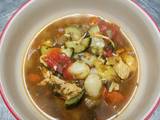 A picture of Chicken vegetable soup with gnocchi.