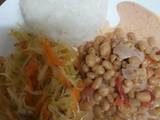 A picture of Rice, steamed cabbage and coconut beans.