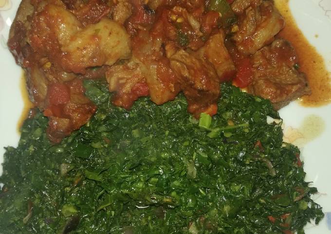 A picture of Fried goat meat with sukuma.