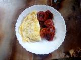 A picture of Fried tomatoes with eggs.