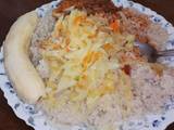 A picture of Rice and chicken stew with steamed cabbage.