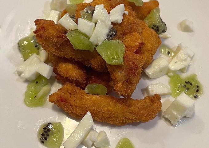 A picture of Tomato goujon with a mozzarella and kiwi salad.