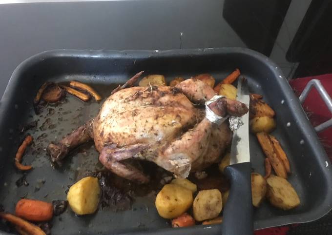 A picture of Roast chicken with vegetables.