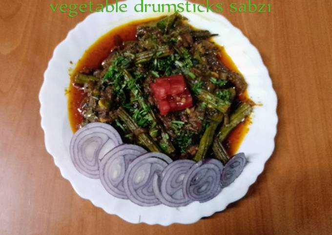 A picture of Vegetable drumsticks sabzi 🍅🧅🌶️🧄.