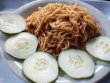 A picture of Jollof spaghetti,diced beef and vegetable.