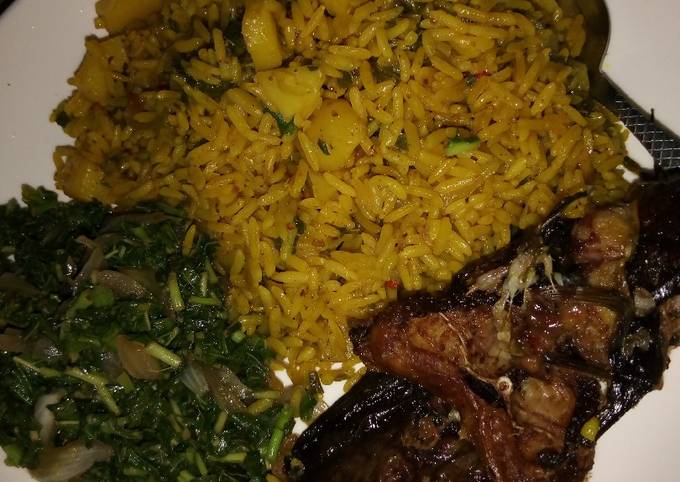 A picture of Jollof Rice and Irish with vegetable Sauce and Cat Fish.