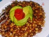 A picture of Chillie infused githeri with tomato rose and avocado rose.