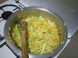 A picture of Steamed cabbage and carrot.