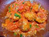 A picture of Meatballs in tomato sauce.