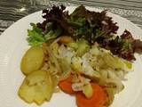 A picture of Cod Fish with vegetables.