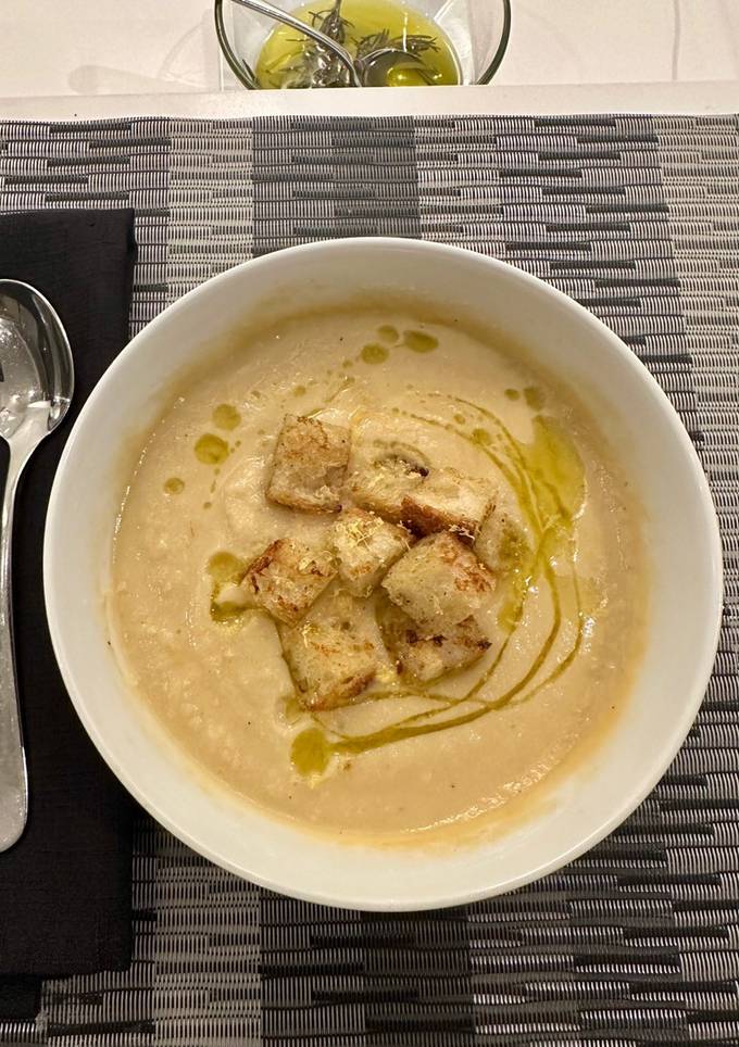 A picture of Creamy Cauliflower Soup with Rosemary Olive Oil.