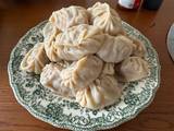 A picture of Uyghur Manta - butternut squash lamb dumplings.