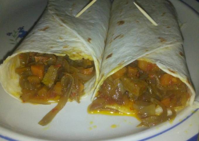 A picture of Tortilla with beef and vegetable sauce.