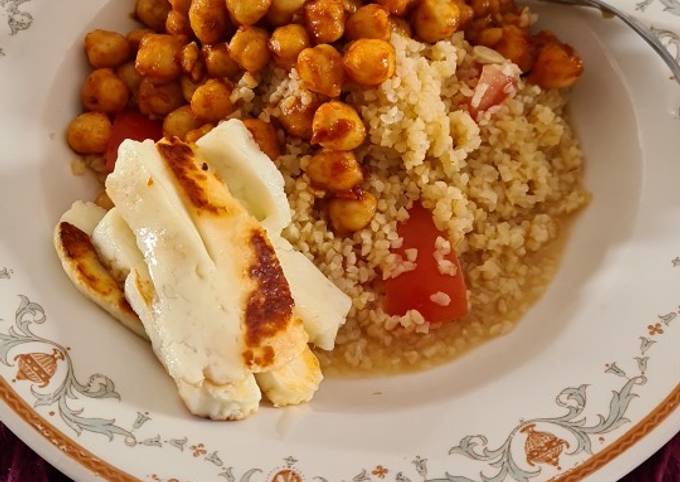 A picture of Honeyed hallloumi on Harissa Tabbouleh with chickpeas tomatoes and yoghurt.