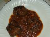 A picture of Meat balls in garlic tomato sauce.