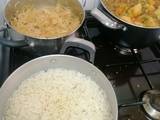 A picture of Mixed vegetable stew with minced meat, rice and a side of cabbage.