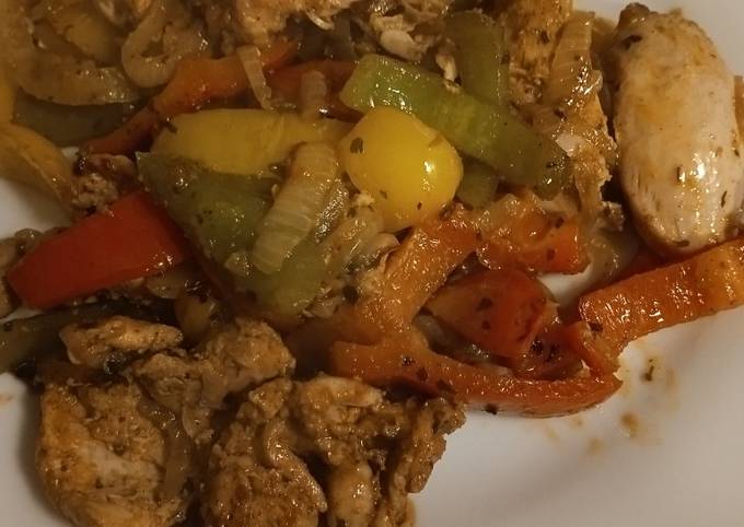 A picture of Tandoori marinated chicken thighs with mixed peppers and onion.