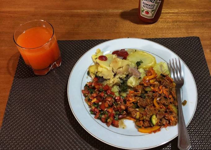 A picture of Beef Stew,Fried Potatoes and Tomato Onion Salad(Kachumbari).