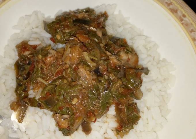 A picture of White rice with Vegetables sauce.