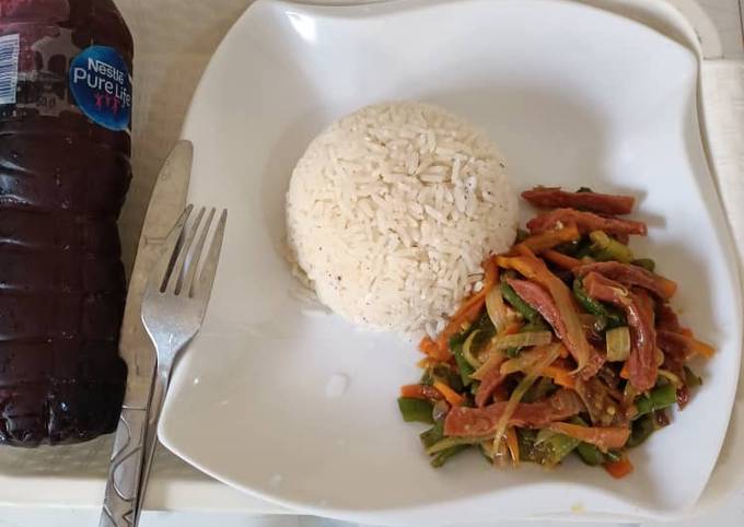 A picture of Coconut rice & vegetable sauce.