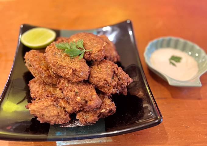 A picture of Cauliflower and cumin fritters with mint yoghurt.