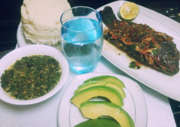 A picture of Fish with creamy kienyeji veges and ugali.