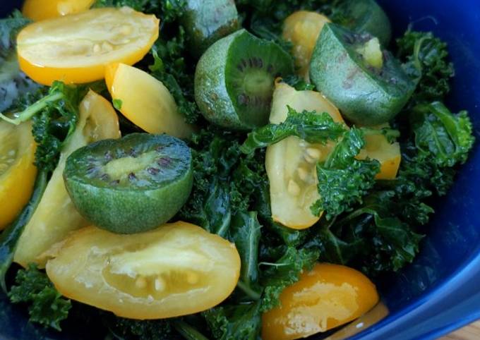 A picture of Raw kale, tomato and kiwiberry salad.