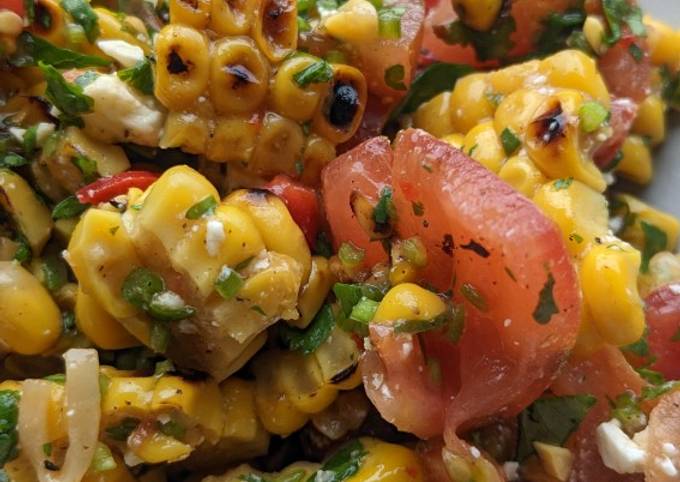 A picture of Brighten-up-your-day Mexican corn + tomato salad.