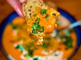 A picture of Creamy Pumpkin Soup with Chimichurri and Sourdough Croutons: The Ultimate Comfort Dish by TastyPinch.