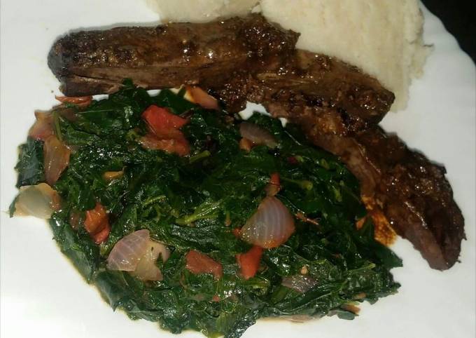 A picture of Grilled Liver, Kunde Veggies Served with Ugali #CharityRecipe.