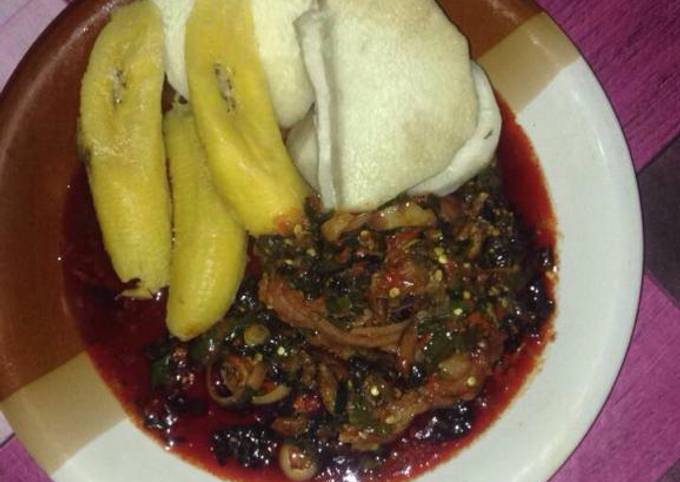 A picture of Boil yam and plantain with vegetable sauce.