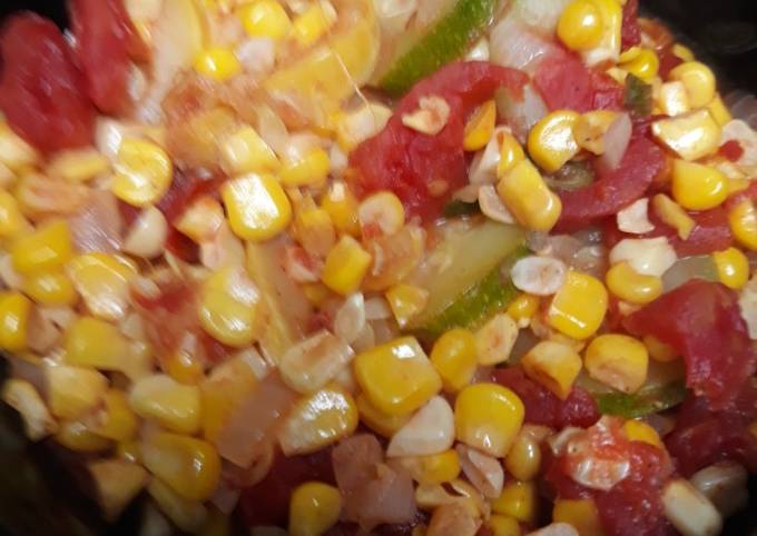 A picture of Vegetables on a stovetop.