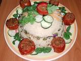 A picture of Stuffed tomatoes 🍅 with Arusha rice 🍚🧄🧅.