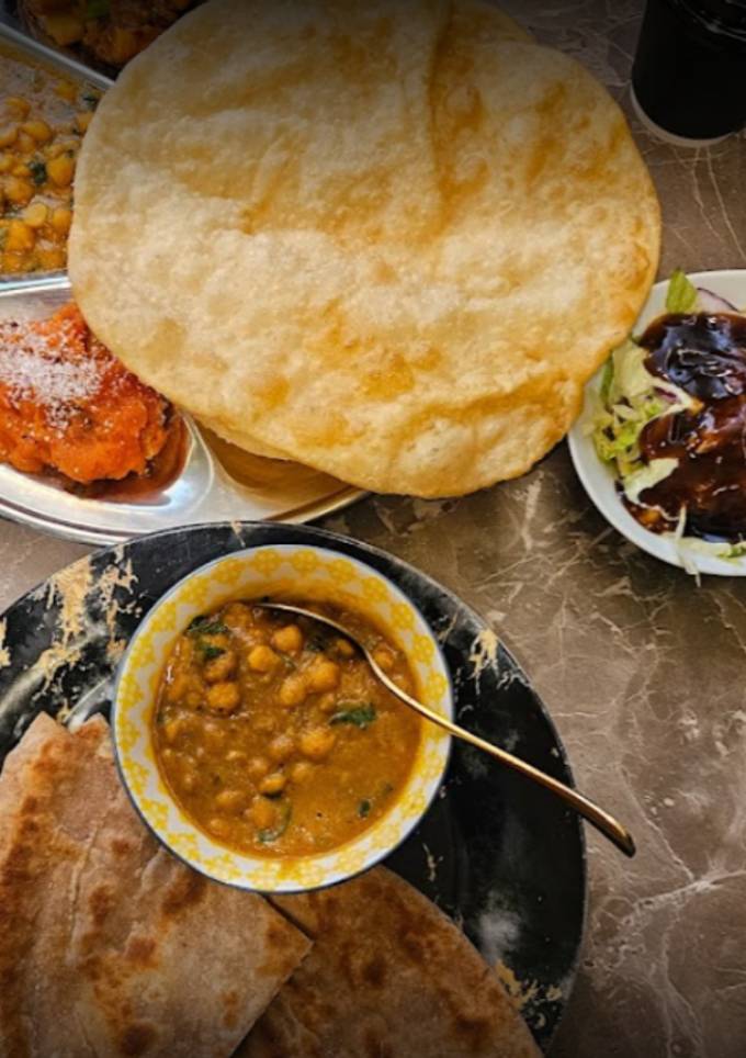 A picture of Halwa Puri – A Classic Desi Breakfast from Infusion Village.