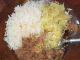 A picture of Stewed beans served with rice and cabbage.