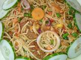 A picture of Pasta with stir fried vegetables and beef.